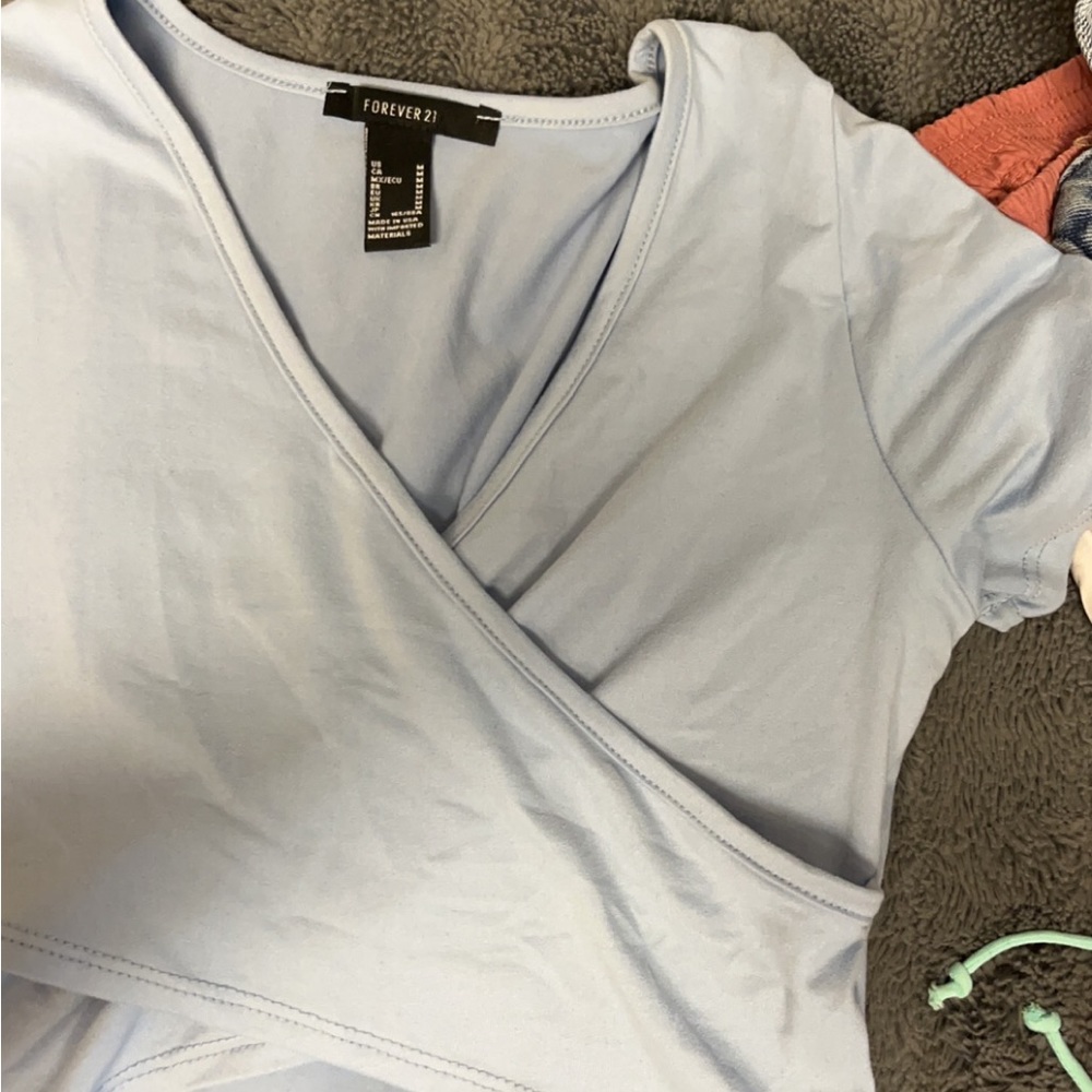 light blue V neck
